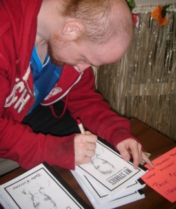 John Howard signing book